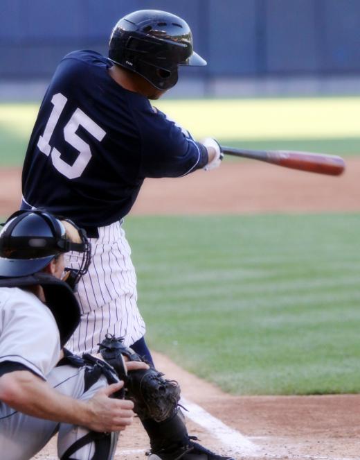 Baseball players may play in a stadium.