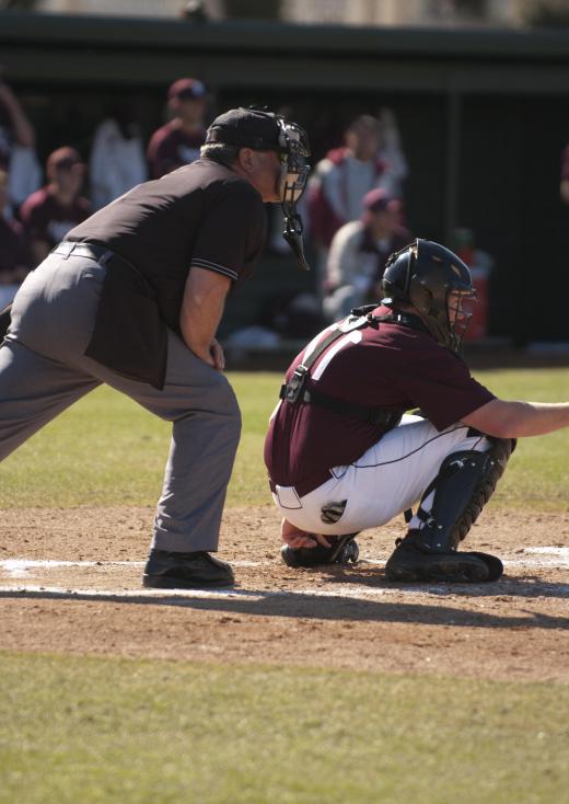 The home plate umpire sets the strike zone by calling balls and strikes.