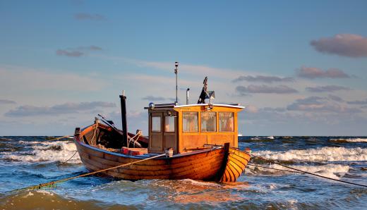 Deep sea fishing typically involves boats that travel out of the sight of land.