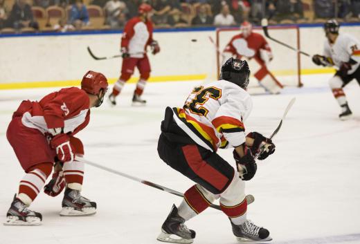 A zamboni is used between periods at a hockey game to smooth out the ice for the players.