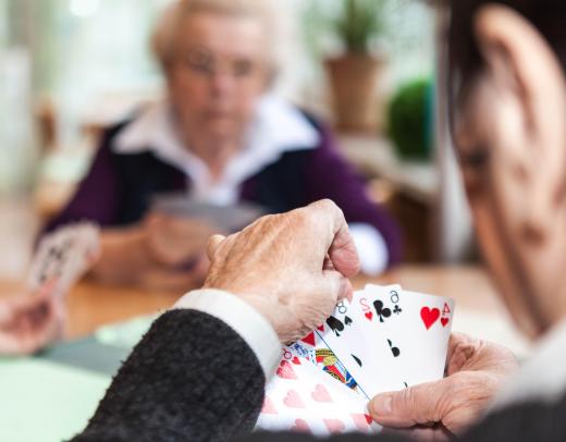 Finding groups who play bridge might be the easiest way to learn.