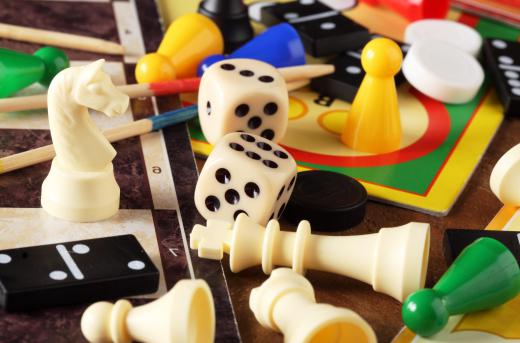 Some gaming pieces like dice, can be re-purposed for use in playing multiple board games.