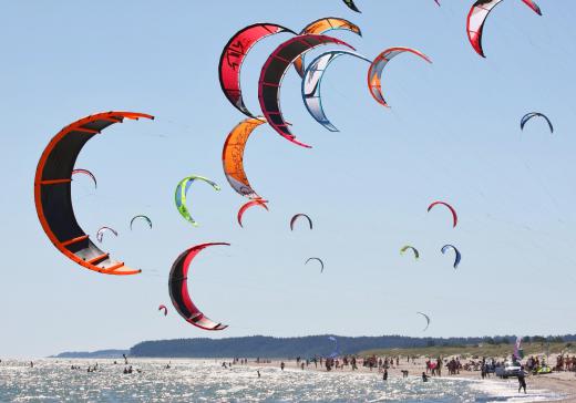 Kitesurfing is also known as kiteboarding, and is an exciting, popular sport in many seaside cities.