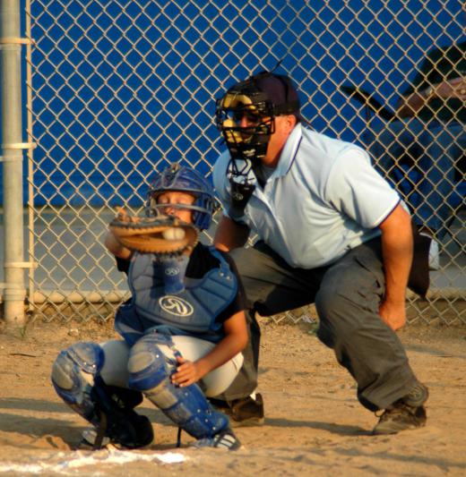 Umpires in baseball wear protective gear.