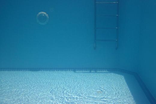 Octopush is played with two opposing teams of six players each at the bottom of a pool.