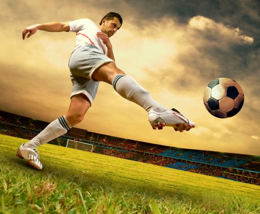 Soccer player kicking the ball.