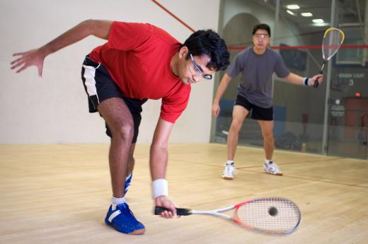 Squash, which usually involves singles or doubles games, is played in an indoor court surrounded by four walls.